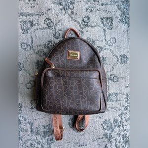 Brown and tan leather Calvin Klein small backpack